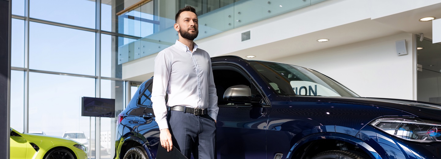Man at auto dealership.